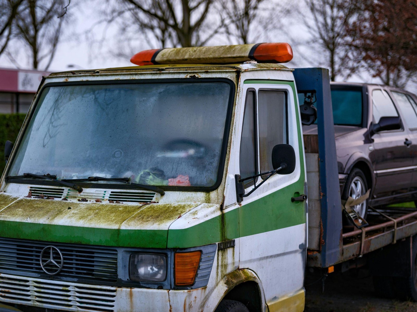 A tow truck helping a stranded vehicle suffering from transmission failure