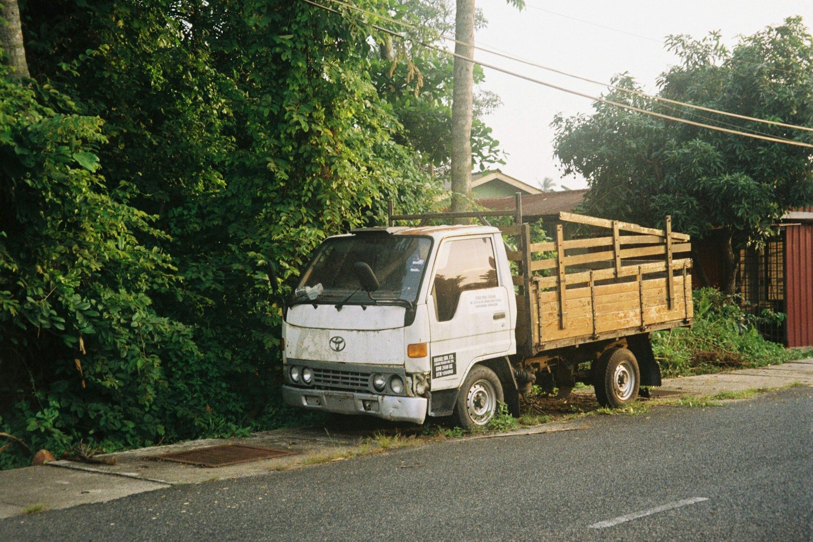 Photo of Sarah standing next to her fixed car